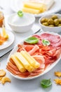 Appetizers with differents antipasti, charcuterie, snacks, meat platter with cheese and spicy olives