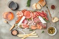 Appetizers with differents antipasti, snacks and wine. Meat antipasto platter. Sausage, ham, tapas, olives. banner, menu, recipe Royalty Free Stock Photo