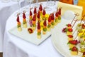 Appetizers, gourmet food - canape with cheese and strawberries, blue-berries catering service. Royalty Free Stock Photo