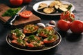 Appetizers- grilled eggplants with tomatoes, garlic and dill. Royalty Free Stock Photo