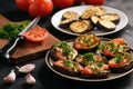 Appetizers- grilled eggplants with tomatoes, garlic and dill. Royalty Free Stock Photo