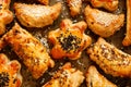 Appetizers with puff pastry with various fillings sprinkled with seeds