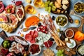 Appetizers table with antipasti snacks and wine in glasses. Authentic traditional spanish tapas set, cheese and meat platter Royalty Free Stock Photo