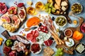 Appetizers table with antipasti snacks and wine in glasses. Bruschetta or authentic traditional spanish tapas set Royalty Free Stock Photo