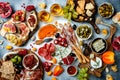 Appetizers table with antipasti snacks and wine in glasses. Bruschetta or authentic traditional spanish tapas set, cheese and meat Royalty Free Stock Photo