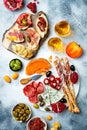 Appetizers table with antipasti snacks and wine in glasses. Bruschetta or authentic traditional spanish tapas set Royalty Free Stock Photo