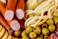 Appetizers table with cheese of olives and sausages and meat variety board Top view Royalty Free Stock Photo