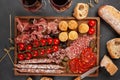 Appetizers table with differents antipasti, cheese, charcuterie, snacks and wine. Mini burgers, sausage, ham, tapas, olives, chees Royalty Free Stock Photo