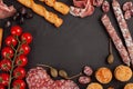 Appetizers table with differents antipasti, cheese, charcuterie, snacks and wine. Mini burgers, sausage, ham, tapas, olives, chees Royalty Free Stock Photo