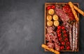 Appetizers table with differents antipasti, cheese, charcuterie, snacks and wine. Mini burgers, sausage, ham, tapas, olives, chees Royalty Free Stock Photo