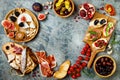 Appetizers table with italian antipasti snacks. Brushetta or authentic traditional spanish tapas set, cheese variety board Royalty Free Stock Photo