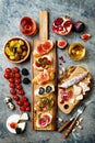 Appetizers table with italian antipasti snacks and wine in glasses. Brushetta or authentic traditional spanish tapas set Royalty Free Stock Photo