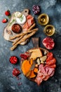 Appetizers table with italian antipasti snacks and wine in glasses. Brushetta or authentic traditional spanish tapas set Royalty Free Stock Photo