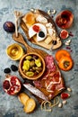 Appetizers table with italian antipasti snacks and wine in glasses. Brushetta or authentic traditional spanish tapas set