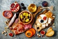 Appetizers table with italian antipasti snacks and wine in glasses. Brushetta or authentic traditional spanish tapas set Royalty Free Stock Photo