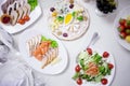 Appetizers. Various types of cheese, salami and prosciutto. Decorated table, buffet Royalty Free Stock Photo