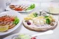 Appetizers. Various types of cheese, salami and prosciutto. Decorated table, buffet Royalty Free Stock Photo
