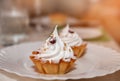 Appetizing baked basket with lemon mousse and whipped cream, whipped egg whites. Food on a white plate for the culinary site. Copy Royalty Free Stock Photo