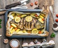 Appetizing baked fish with lemons, topview Royalty Free Stock Photo