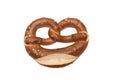 Appetizing Bavarian pretzel isolated on white background. Bavarian traditional bread, a symbol of Germany, cultural and culinary