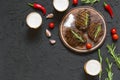 Appetizing beef steaks, beer and rosemary. top veiw Royalty Free Stock Photo