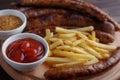 Appetizing beer snacks set close up. Assorted sausages, french f Royalty Free Stock Photo