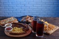 Appetizing beer snacks set. Pork slices, grilled sausages and fr Royalty Free Stock Photo