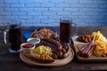 Appetizing beer snacks set. Pork slices, grilled sausages and fr Royalty Free Stock Photo