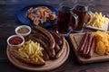 Appetizing beer snacks set. Top view on table with pork slices, Royalty Free Stock Photo