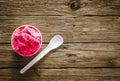 Appetizing berry ice cream on a rustic table