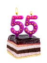 Appetizing birthday cake with burning candles for 55th anniversary