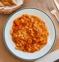 Appetizing braised beans with chorizo sausage pieces