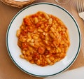 Appetizing braised beans with chorizo sausage pieces