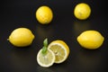 Appetizing bright lemons on a black background