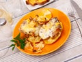 Pork steaks and potatoes baked with onions and cheese Royalty Free Stock Photo