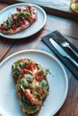 Appetizing bruschetta on a white plate. restaurant server Royalty Free Stock Photo