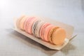 Appetizing cakes macaroons in the package close up Royalty Free Stock Photo