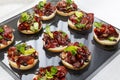 Appetizing canapes with meat sandwiches. Catering for business meetings, events and celebrations. Close-up