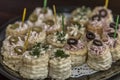 Appetizing canapes on a plate on the table. Close-up