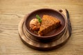 Appetizing carrot cake with apple sorbet ice cream in a clay bowl on a wooden background. A healthy dessert. Pastry Royalty Free Stock Photo