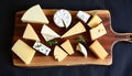 Cheese platter with various cheeses, gourmet selection, appetizer or snack Generative AI Royalty Free Stock Photo