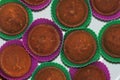 Appetizing chocolate cupcakes in silicon baskets top view Royalty Free Stock Photo