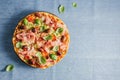 Italian pizza on blue rustic textile Royalty Free Stock Photo