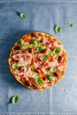 Italian pizza on blue rustic textile Royalty Free Stock Photo