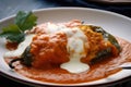 Appetizing close-up of Chiles Rellenos stuffed with shredded chicken and topped with a zesty tomato sauce