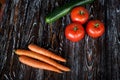 Appetizing composition of fresh vegetables on a wooden dark textured table