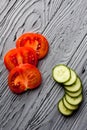 An appetizing composition of sliced ripe tomato and cucumber