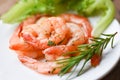 Appetizing cooked shrimps baked prawns , Seafood shelfish - Shrimp grilled delicious seasoning spices on white plate wooden Royalty Free Stock Photo