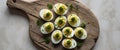 Appetizing deviled eggs adorned with fresh herbs on a rustic wooden board showcasing culinary delight and gourmet Royalty Free Stock Photo