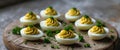 Appetizing deviled eggs adorned with fresh herbs on a rustic wooden board showcasing culinary delight and gourmet Royalty Free Stock Photo